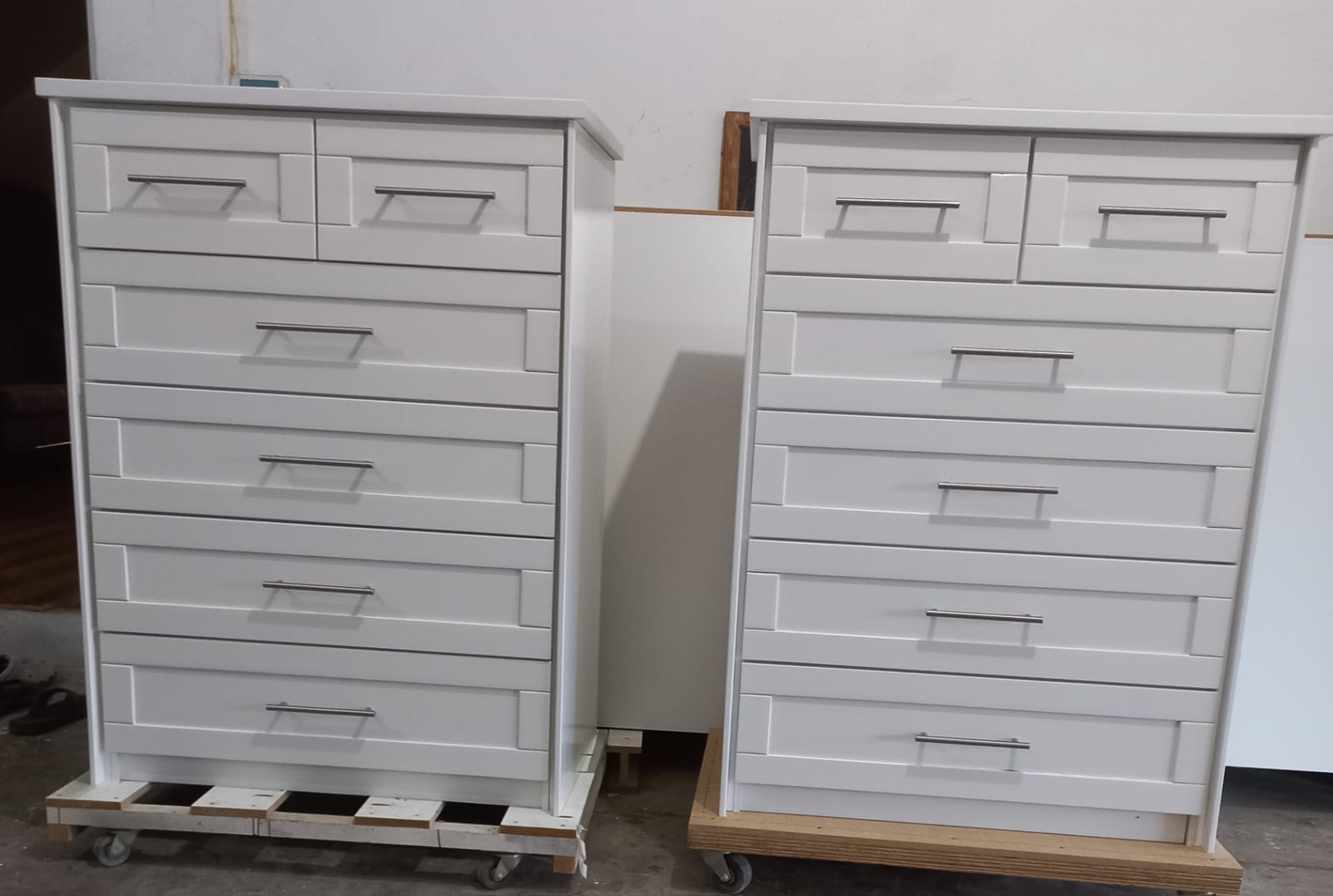 Pair of white six-drawer dressers on casters