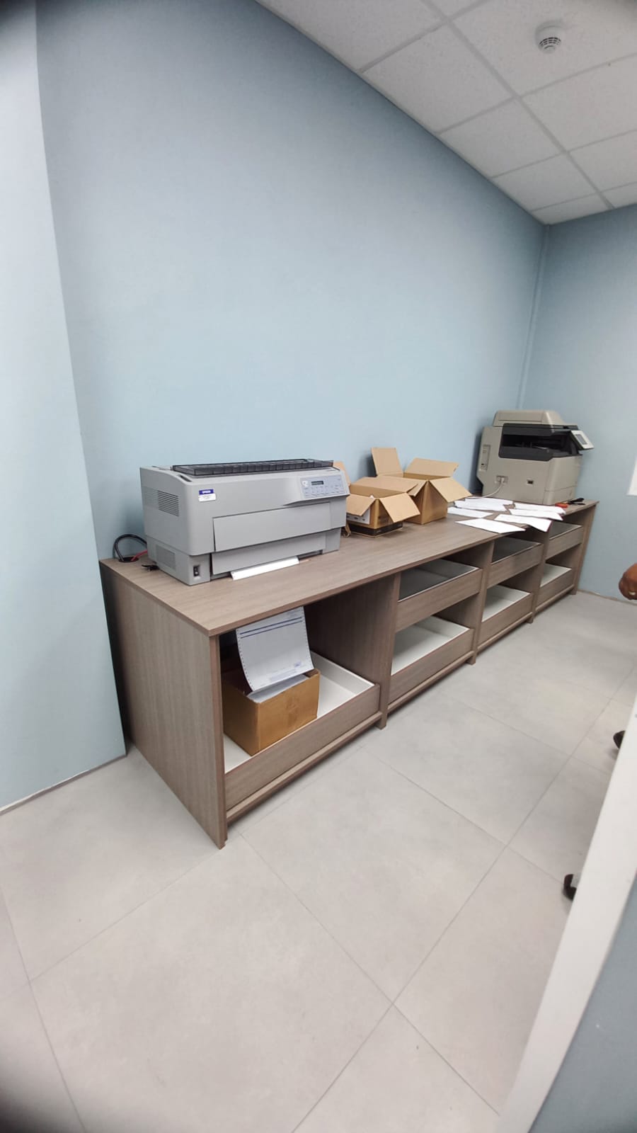 Long office storage counter with open shelving